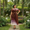 Nigerian female model wearing brown pleated midi occasion dress