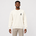Cream windmill-graphic sweatshirt worn by an adult model
