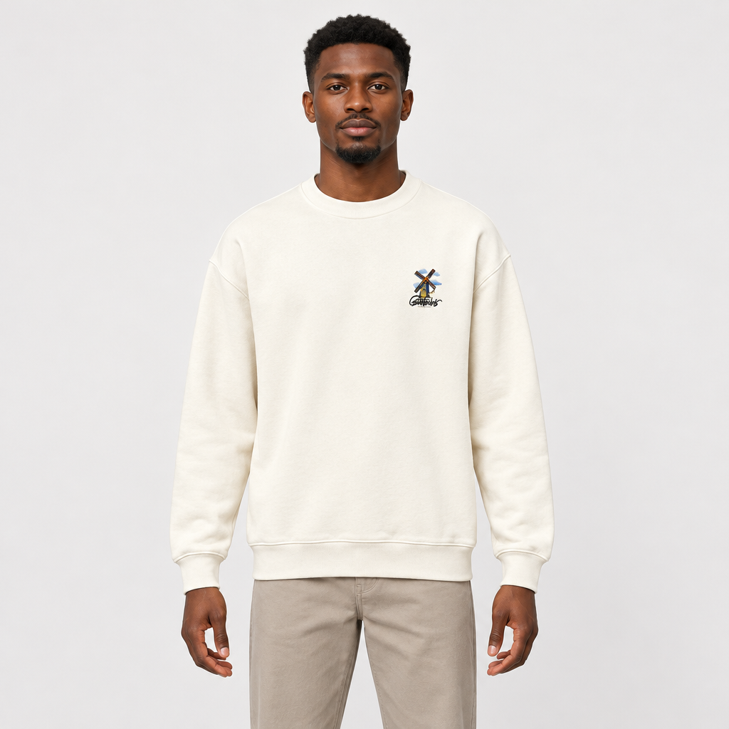 Cream windmill-graphic sweatshirt worn by an adult model