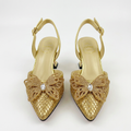 Gold butterfly-detail pointed-toe slingback low-heel pair