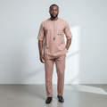 Black Nigerian model wearing the dusky-pink Senator Wear set
