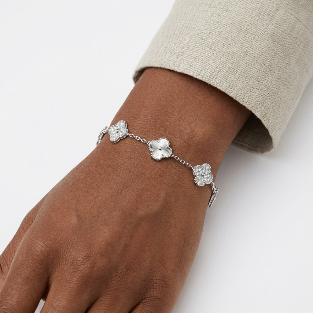 Silver stone-accent clover bracelet on a Black adult wrist