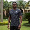 Nigerian male model wearing black mosaic-pattern sport jersey