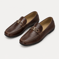 Dark brown men's loafers with polished metal detail shown as a complete pair