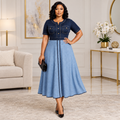 Adult Black woman wearing two-tone blue short-sleeve flared dress