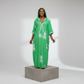 Nigerian female model wearing Green Adire Floral Hooded Long Bubu Gown