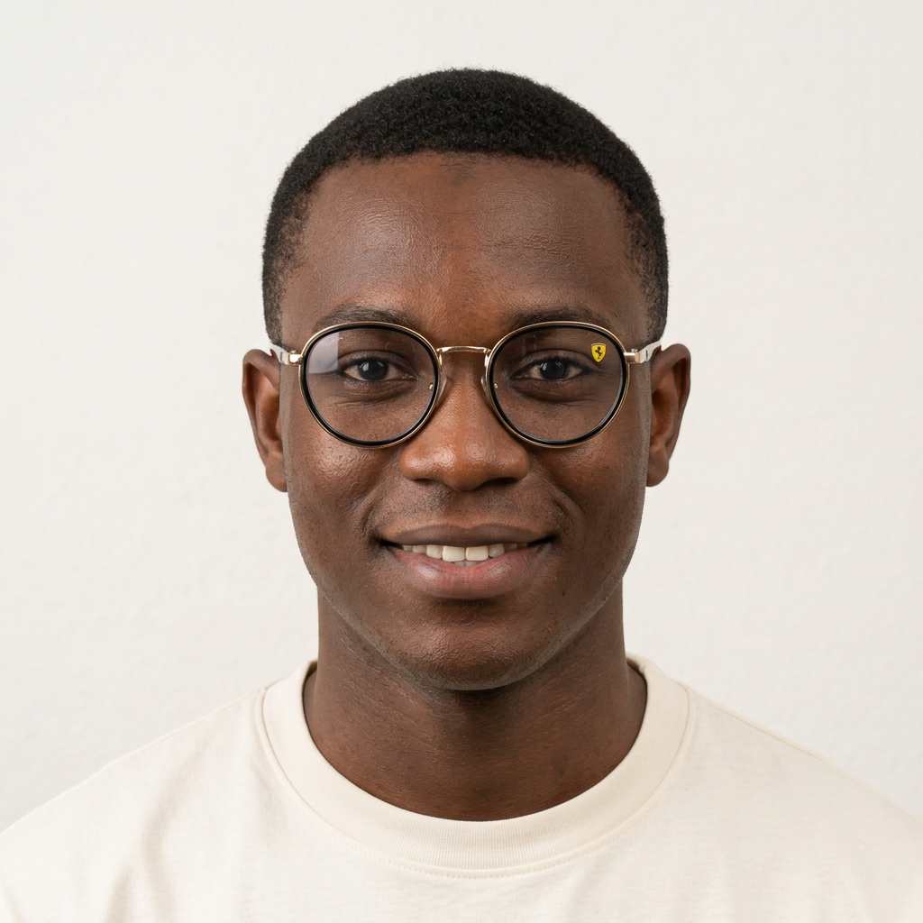 Nigerian Black male model wearing black and gold-tone rounded eyeglasses