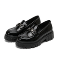 Matching pair of black glossy linked-detail chunky loafers together