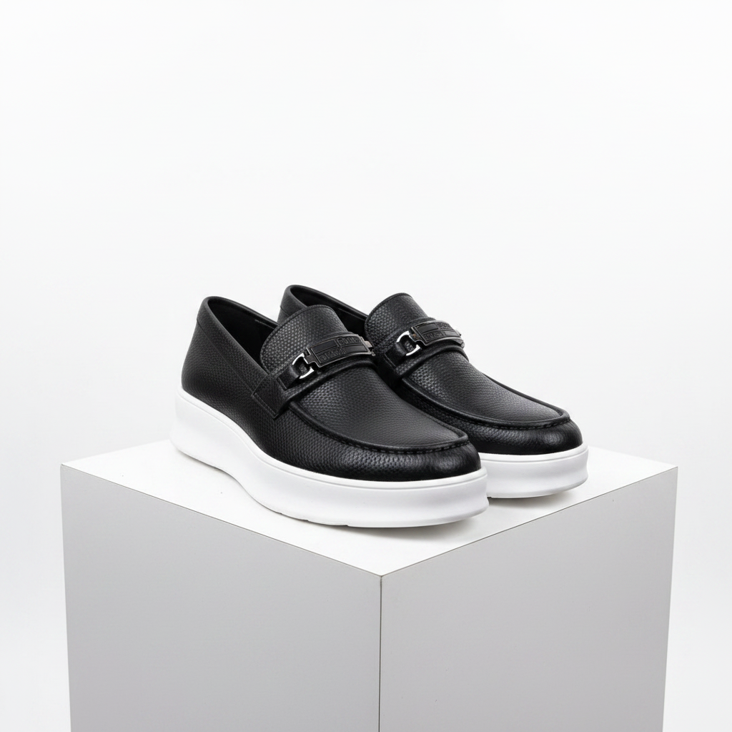 Men's all-black pebbled leather platform loafers with metal bar detail pair product shot