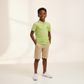 Nigerian boy model wearing lime green polo shirt