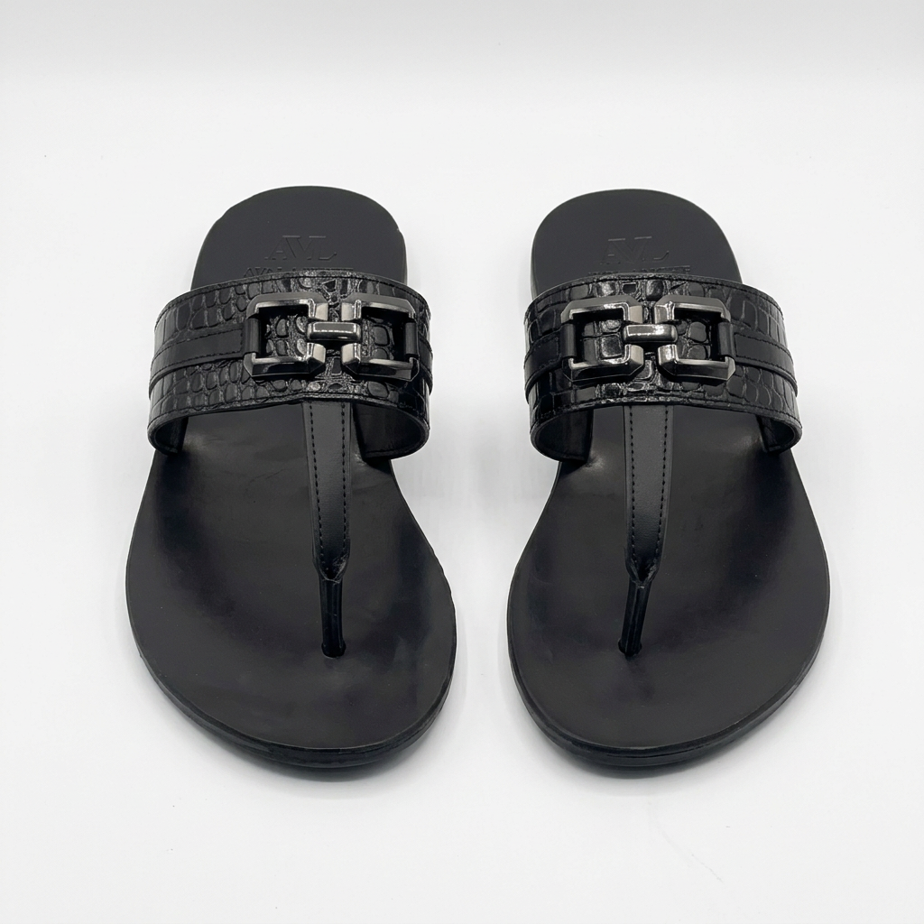 Pair of black croc-textured buckle thong sandals on white