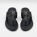 Pair of black croc-textured buckle thong sandals on white