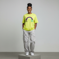Nigerian female model front view wearing neon yellow rainbow smiley T-shirt