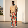 Male model wearing cream ribbed abstract print polo and trouser two-piece set