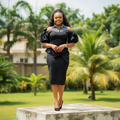 Women's Black Stripe Cold Shoulder Puff Sleeve Peplum Midi Dress – Nigerian Female Model Shot
