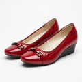 Matching red croc-embossed buckle-strap wedge shoes