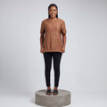 Nigerian female model front view wearing brown quilted embossed horseshoe tee