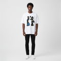 Man wearing the white illustrated duo print oversized tee