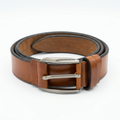 Tan brown belt with dark edges and sculpted silver-tone buckle on white background