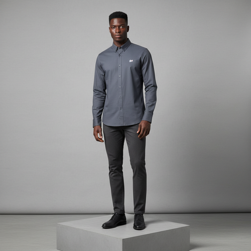 Nigerian male model wearing charcoal grey plain long-sleeved shirt, front view