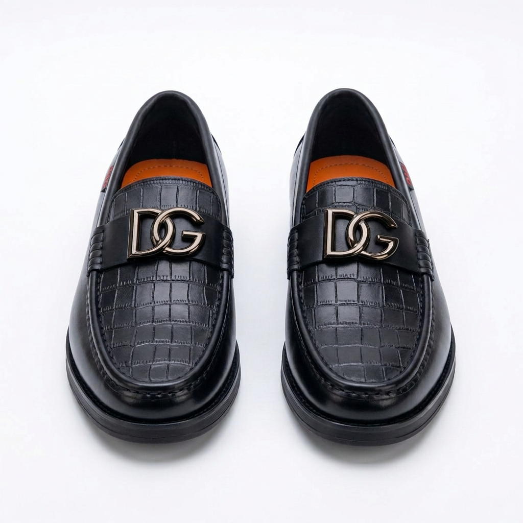 Pair of black men's croc-panel hardware loafers on white