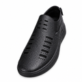 Black textured closed-toe slip-on shoe with cutout details