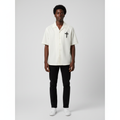 Man wearing the cream cross motif camp collar shirt