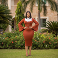 Nigerian female model wearing women's rust terracotta bell sleeve white collar bodycon midi dress