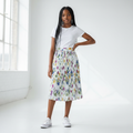 Nigerian teenage girl wearing white multicolour floral pleated midi skirt