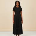 Nigerian girl wearing black pleated midi skirt - front view