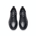 Men's black embossed monogram leather lace-up sneakers pair product shot