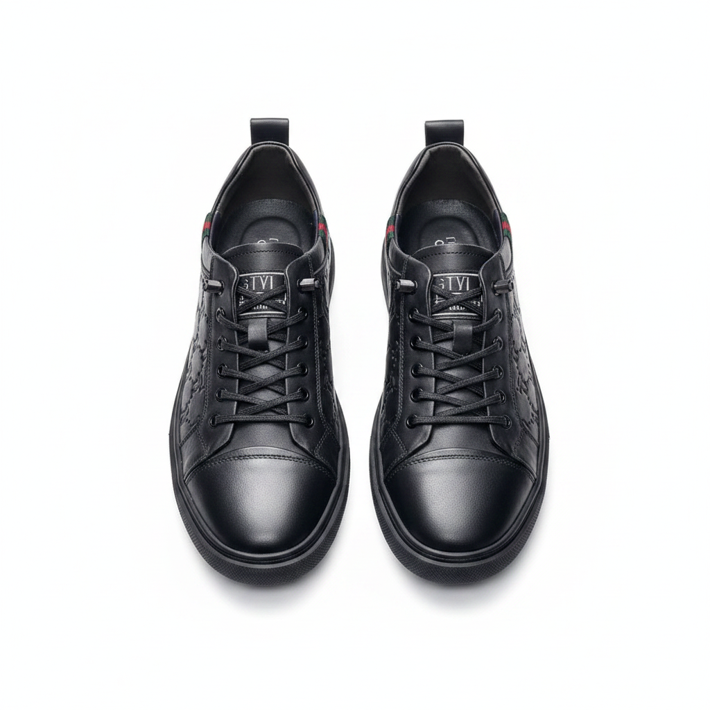 Men's black embossed monogram leather lace-up sneakers pair product shot