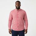 Adult Black model wearing a red and white gingham long-sleeve shirt