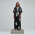 Nigerian female model wearing Black Adire Floral Hooded Long Bubu Gown