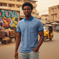 Young Nigerian male model wearing blue wave print polo shirt