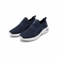 Navy blue knit slip-on sneakers pair with white sole on white background