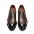 Straight-on brown script-detail slip-on shoes with darker burnished toes