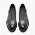 Straight-on smoky charcoal-grey script-detail slip-on shoes with darker toes