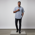 Nigerian male model wearing navy blue gingham short-sleeved shirt