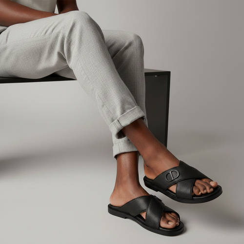 Nigerian male model wearing black pebbled leather cross-strap slides