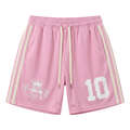 Pink drawstring shorts with twin light side stripes and white number and crowned crest graphics