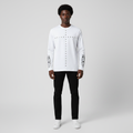 Man wearing the white studded cross long sleeve tee