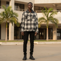 Model wearing black plaid tweed distressed zip jacket