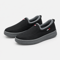 Black grey-collar slip-on shoe pair on a clean background