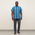 Nigerian model wearing Blue Madras Plaid Short Sleeve Shirt – Front View