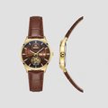 Gold-tone open-heart watch with brown dial and brown textured strap shown from the front and side