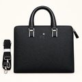 Black textured top-handle bag with detached shoulder strap
