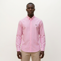 Male model wearing a pink pinstripe long-sleeve shirt against a plain off-white background