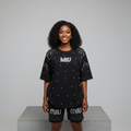 Nigerian female model front view - black pearl rhinestone top and shorts set