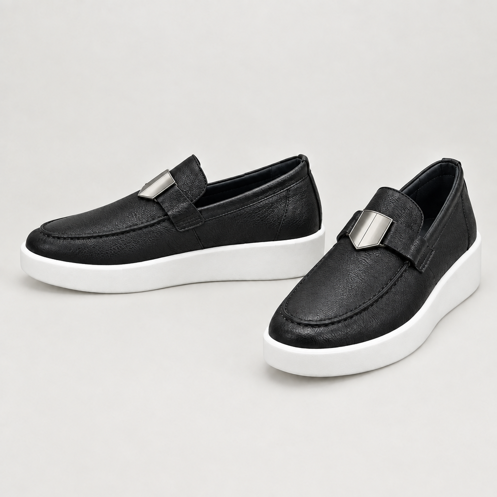 Men's black textured loafers with plain silver-tone hardware and white soles